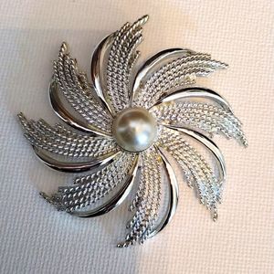 Sarah Cov flower with pearl center brooch.